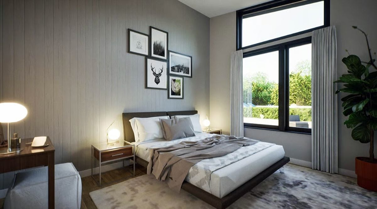Gallery Wall, Warm Lamp Glow, and a Platform Bed in a Gray Bedroom