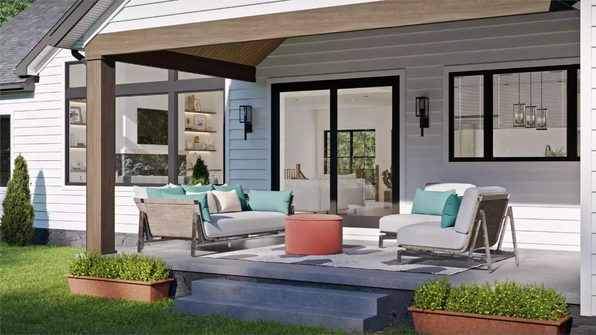 Covered Patio With Teal Accents and a Coral Ottoman Bridges Indoors and Out
