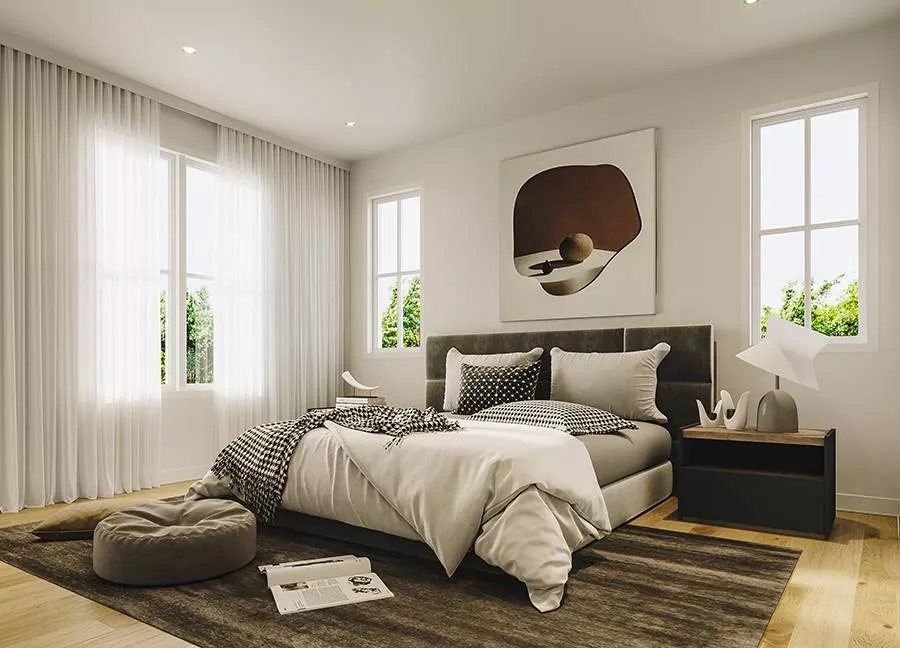 Houndstooth Bedding and a Dark Headboard Ground This Neutral Primary Bedroom