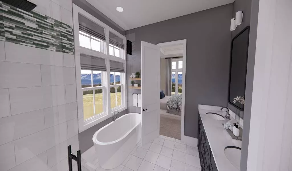 Freestanding Tub Sits Below Mountain Views in a Gray-and-White Bath