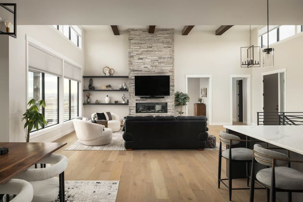 Floor-to-Ceiling Stone Fireplace Anchors an Open-Concept Living Space