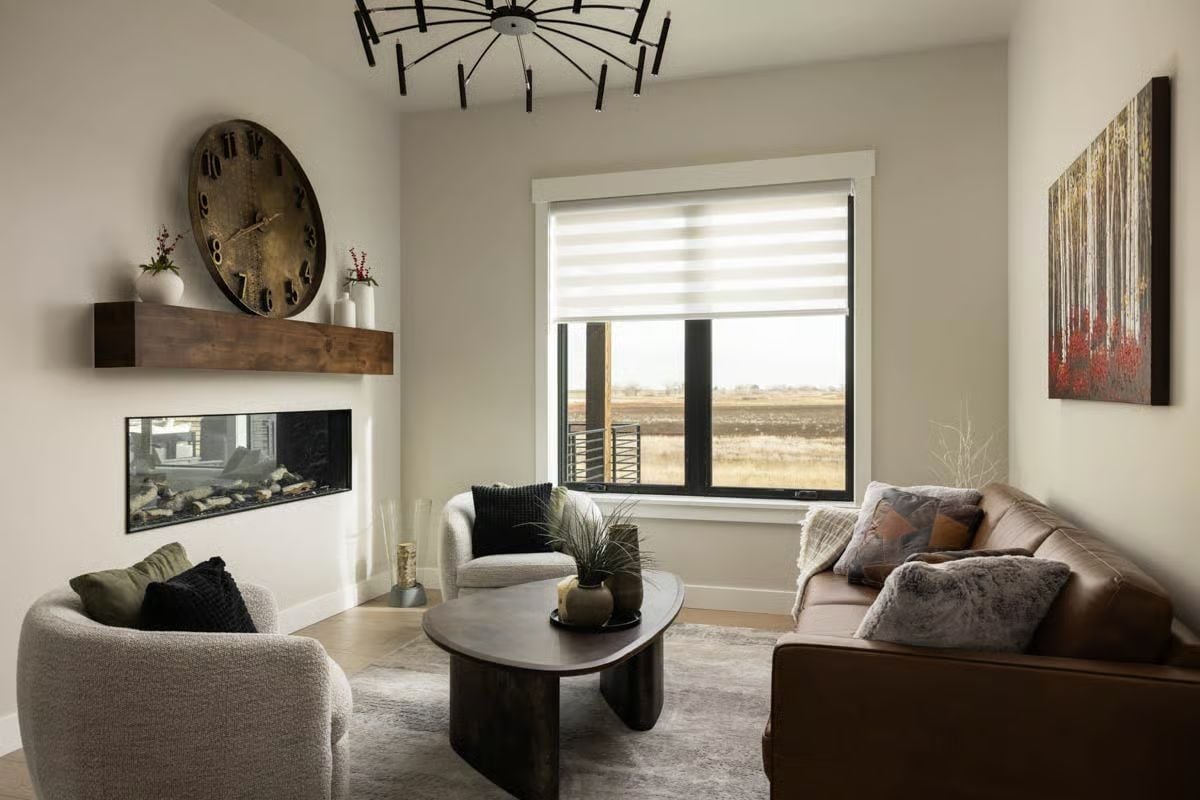 Oversized Wall Clock and Linear Fireplace Ground a Living Room Built on Warm Contrast