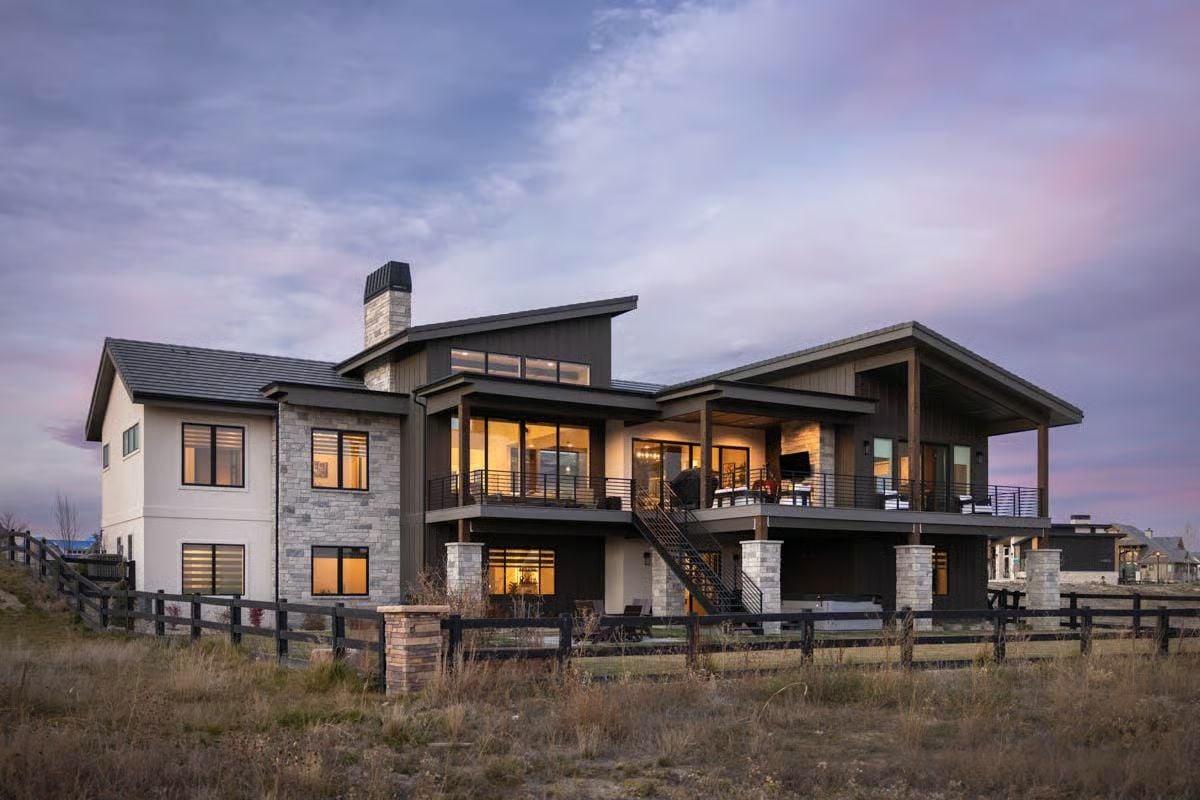 Covered Deck and Stone Columns Frame a Mountain Home Built for Open-Air Living