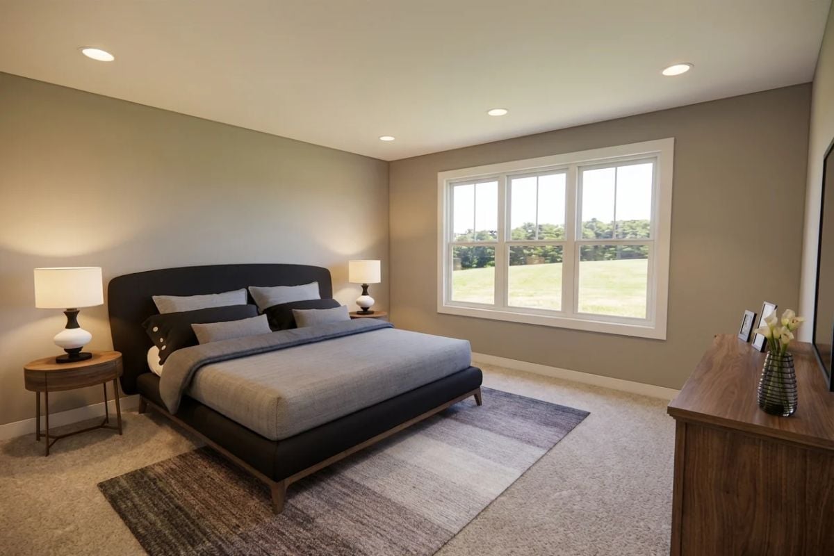 Bedroom Built Around Calm Tones, Soft Carpet, and a View of Open Lawn
