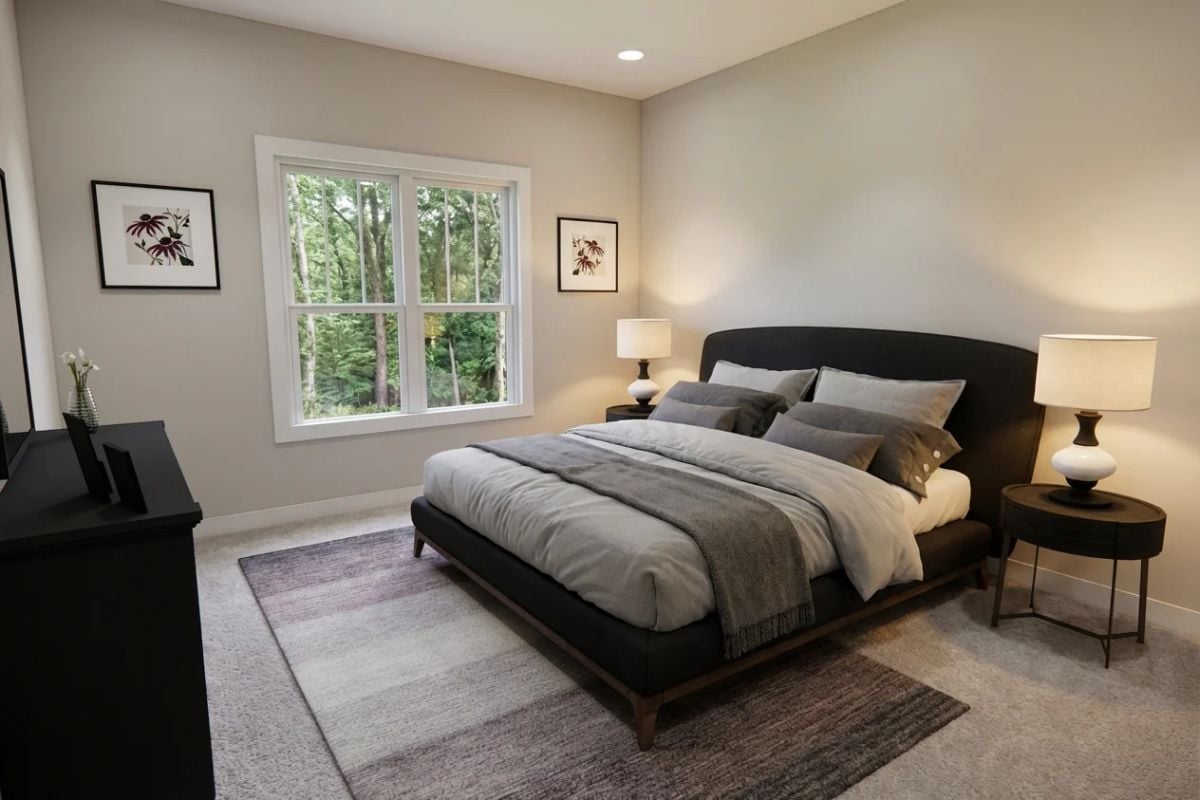 Gray Bedding and Dark Furniture Keep This Primary Bedroom Grounded