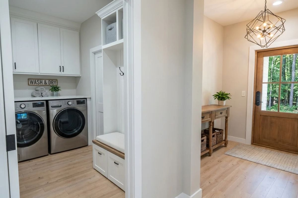 Mudroom Bench and Built-Ins Connect Directly to a Functional Laundry Space