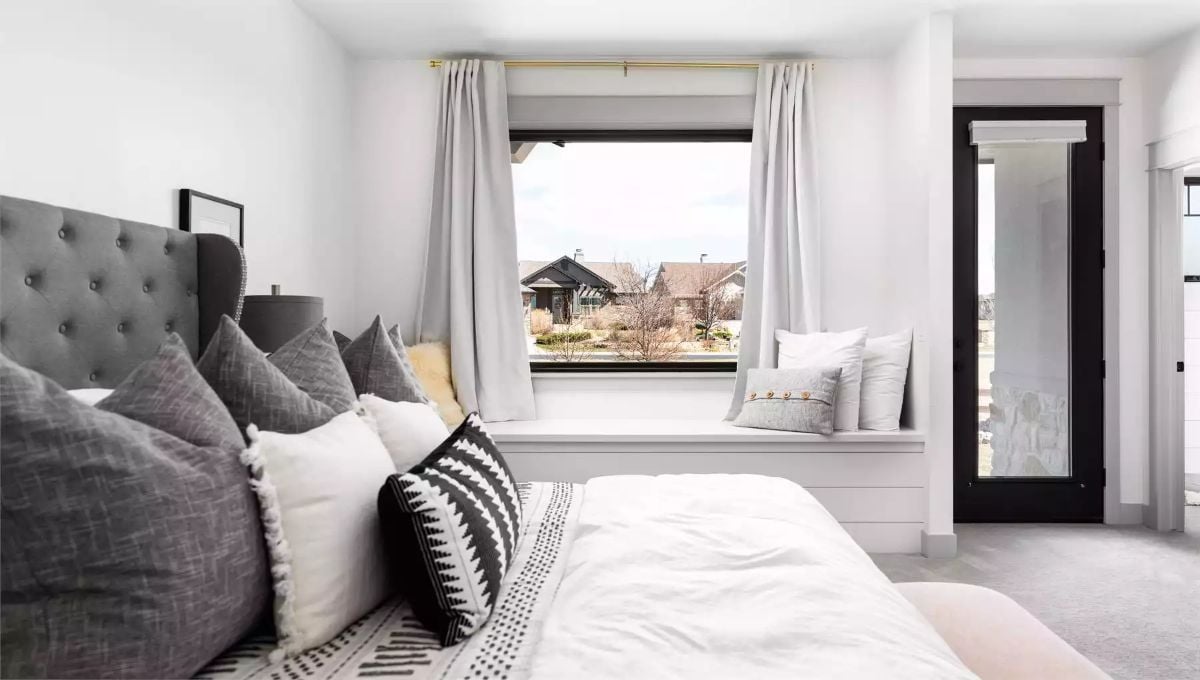 Tufted Headboard, Window Seat, and Pillows Stacked With Purpose