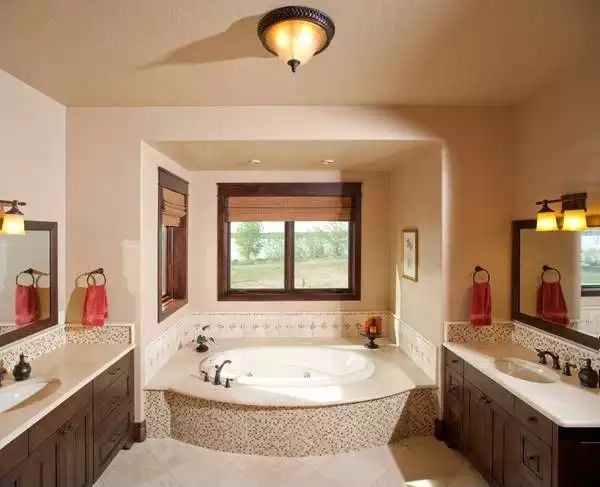 Mosaic-Tiled Soaking Tub Sits Center Stage in a Craftsman Master Bath