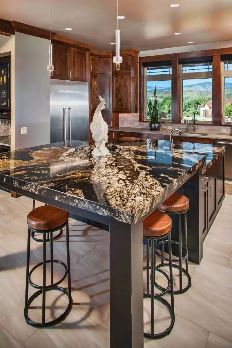 Black and Gold Granite Island Commands Attention in a Craftsman Kitchen