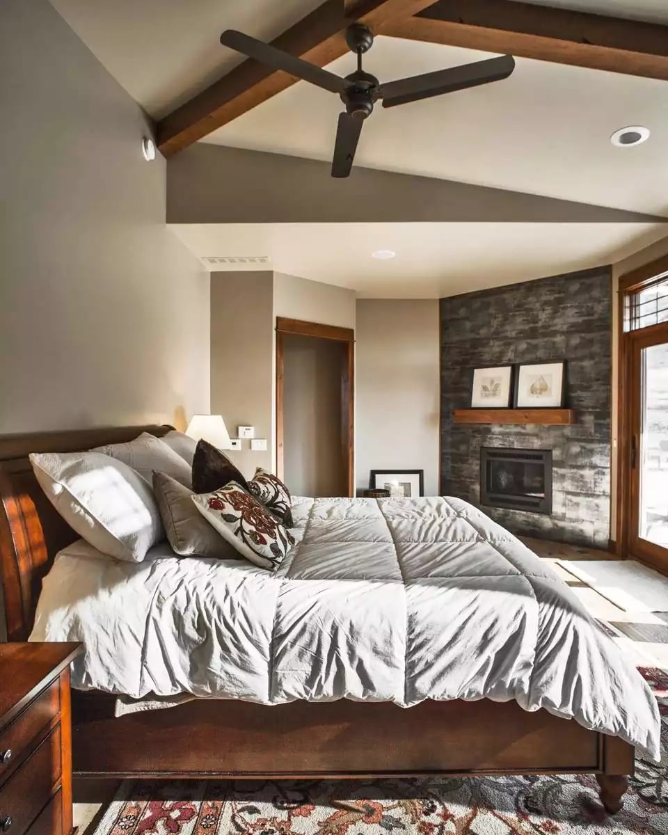 Vaulted Ceiling with Exposed Beams Frames a Craftsman Master Bedroom
