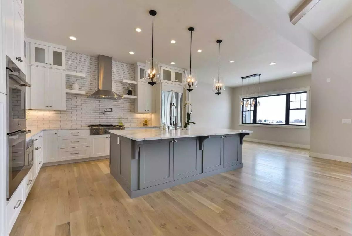 Gray Island Anchors a White Kitchen Built for Serious Cooking