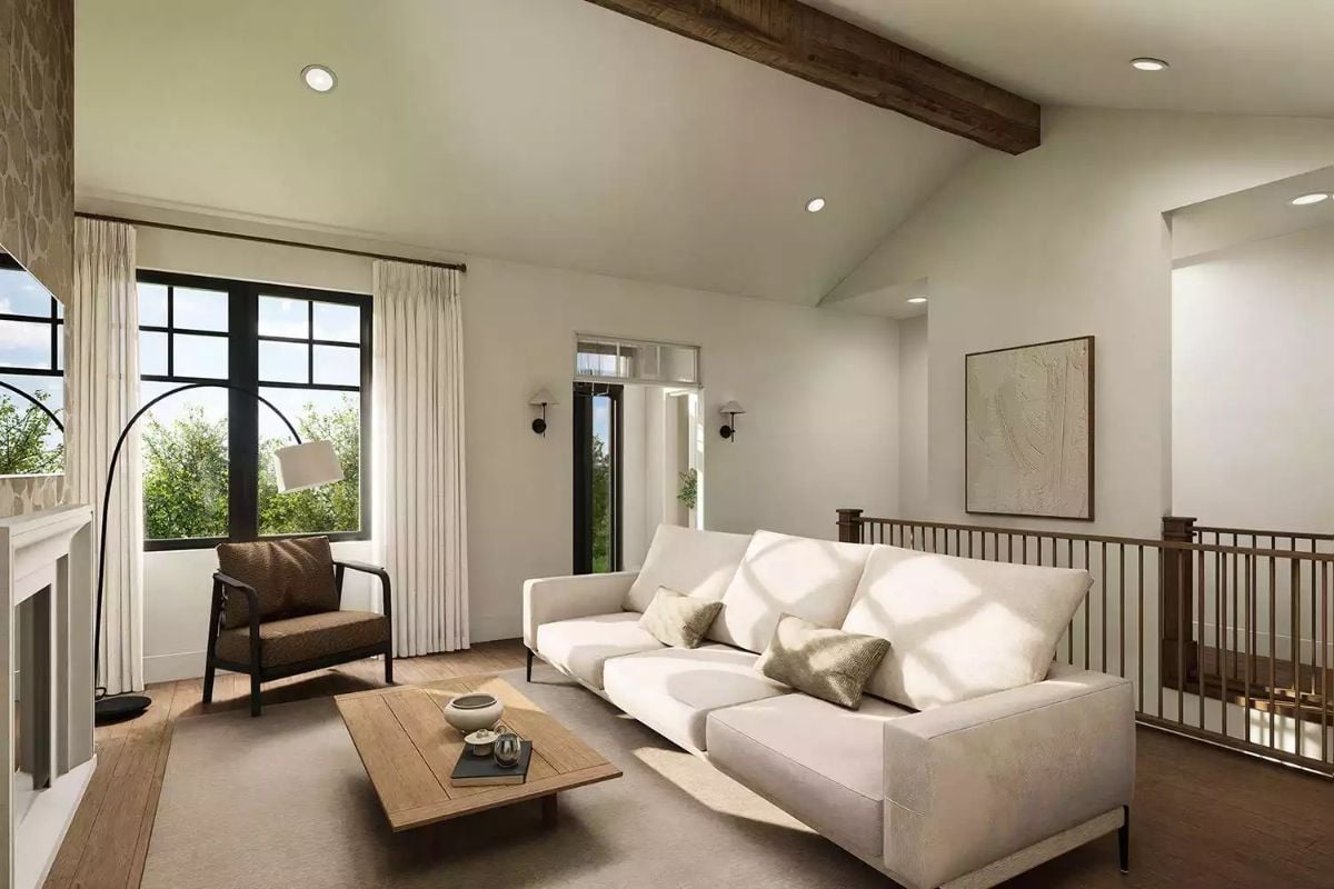 Exposed Beam Ceiling and Cream Sofa Define an Upper-Level Living Space