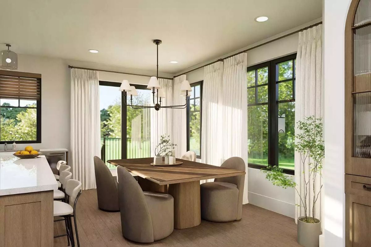 Rounded Chairs and a Wood Table Turn a Corner Dining Nook Into a Social Hub