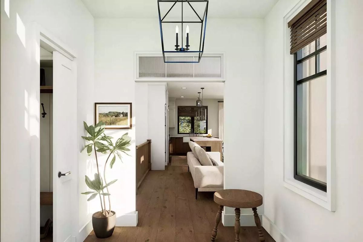 Candle-Style Lantern Anchors a Hallway Built for Easy Living