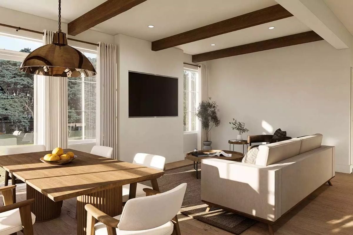 Open-Concept Living and Dining Area with Exposed Beam Ceiling