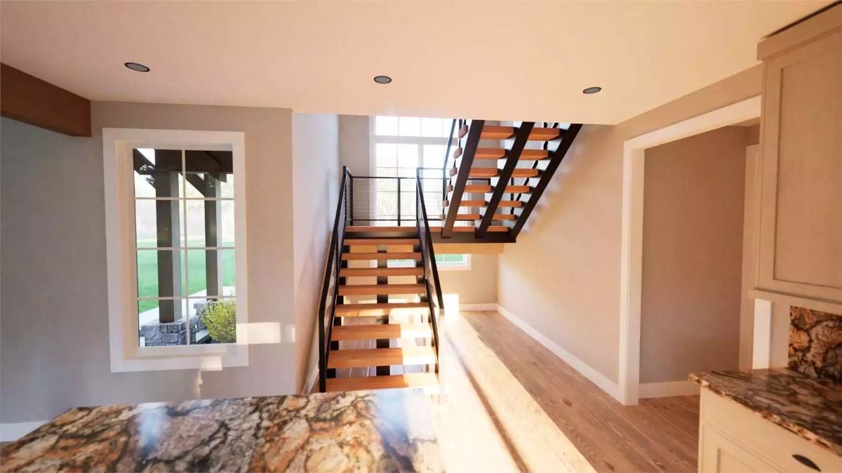 Open Staircase with Wood Treads and Metal Railings Leading to Loft