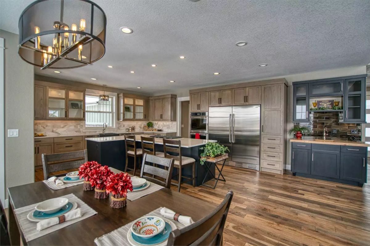 Stainless Steel Appliances and Dual Cabinet Finishes Shape a Hardworking Kitchen
