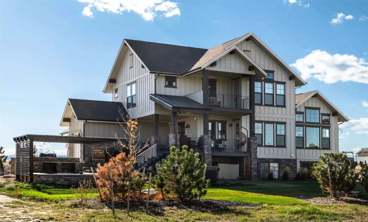 Craftsman Exterior with Stone Base and Multi-Level Decks Commands an Open Sky View