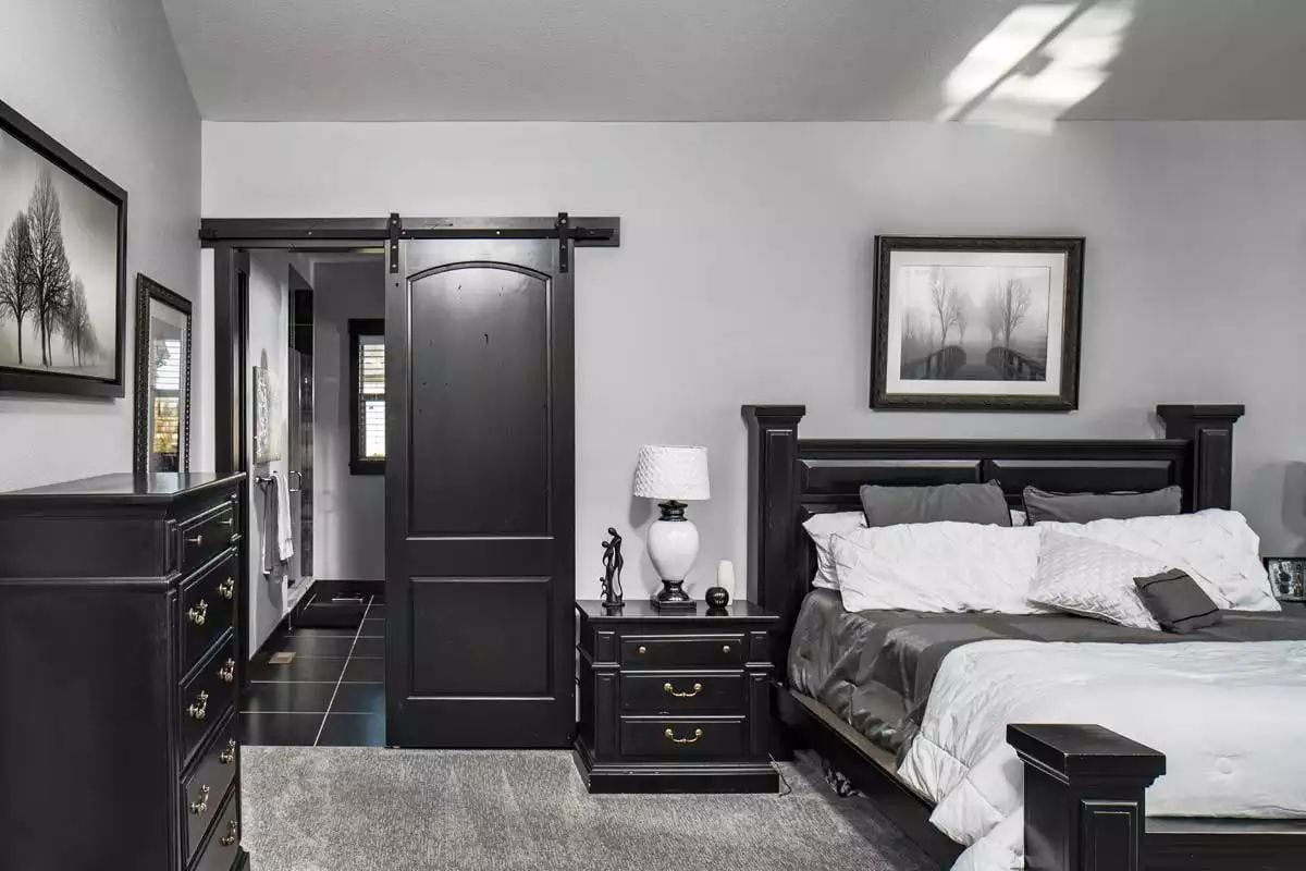 Black Barn Door and Matching Furniture Give This Bedroom Real Edge