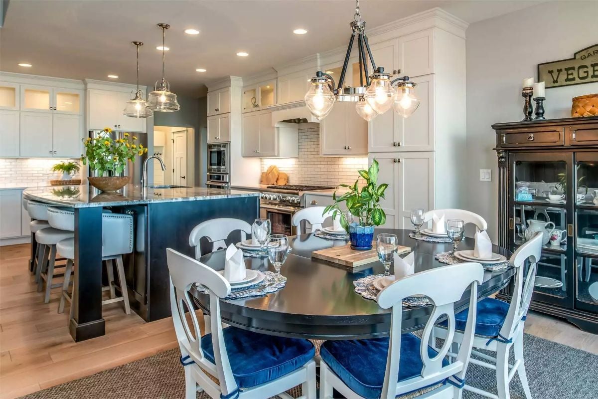 Open Kitchen and Dining Area with Blue Velvet Seating