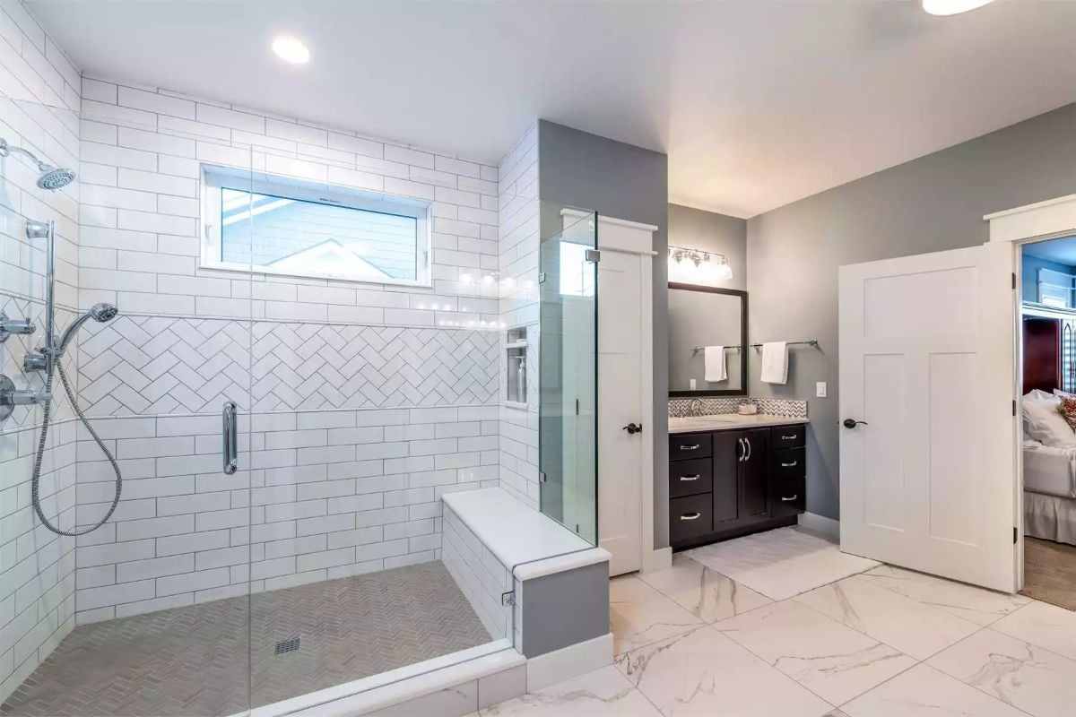 Spa-Inspired Primary Bathroom with Herringbone Tile Shower
