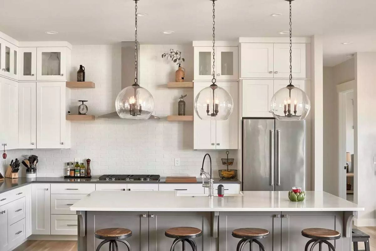 Globe Pendants and Industrial Stools Give This Kitchen Its Character