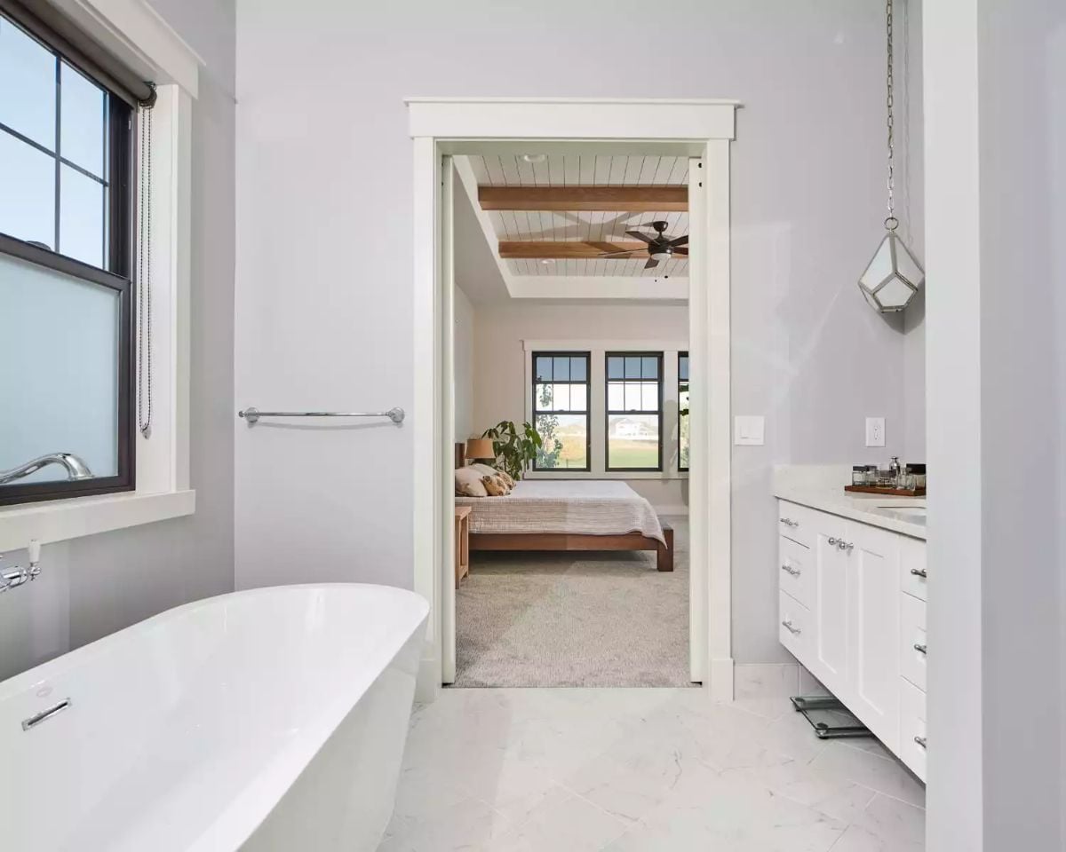 Freestanding Tub and Marble Tile Set a Quiet Tone in This Ensuite