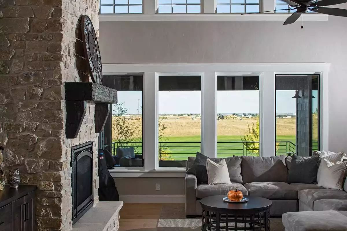 Stone Fireplace Tower and Prairie Views Define This Great Room