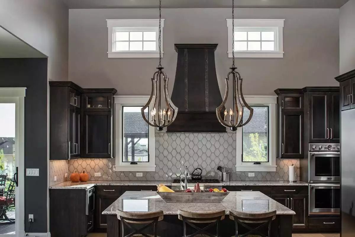 Dark Wood, Hex Tile, and Two Pendant Lanterns Frame a Kitchen Built for Serious Cooking