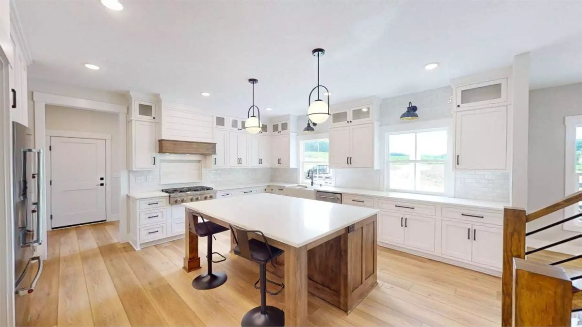 Warm Wood Tones Meet White Cabinetry in This Farmhouse Kitchen