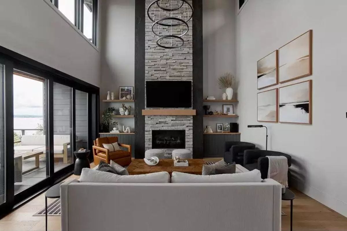 Vaulted Living Room with Stone Fireplace and Floor-to-Ceiling Windows