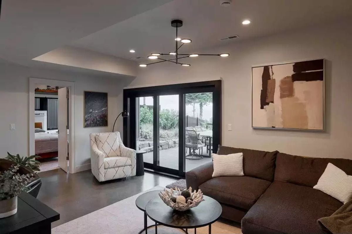 Contemporary Family Room with Modern Chandelier and Sliding Glass Doors