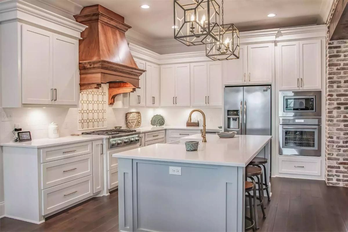Copper Range Hood and Cage Pendants Give This Kitchen Real Character