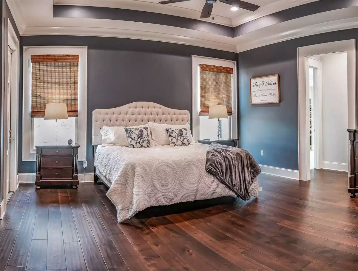 Tufted Headboard and Woven Shades Bring Texture to This Gray Master Bedroom