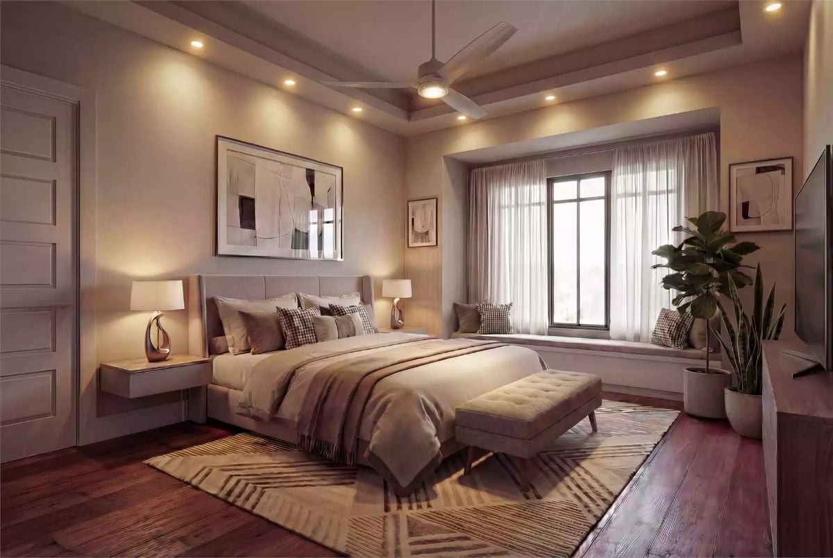Warm Recessed Lighting and a Window Seat Make This Bedroom Hard to Leave