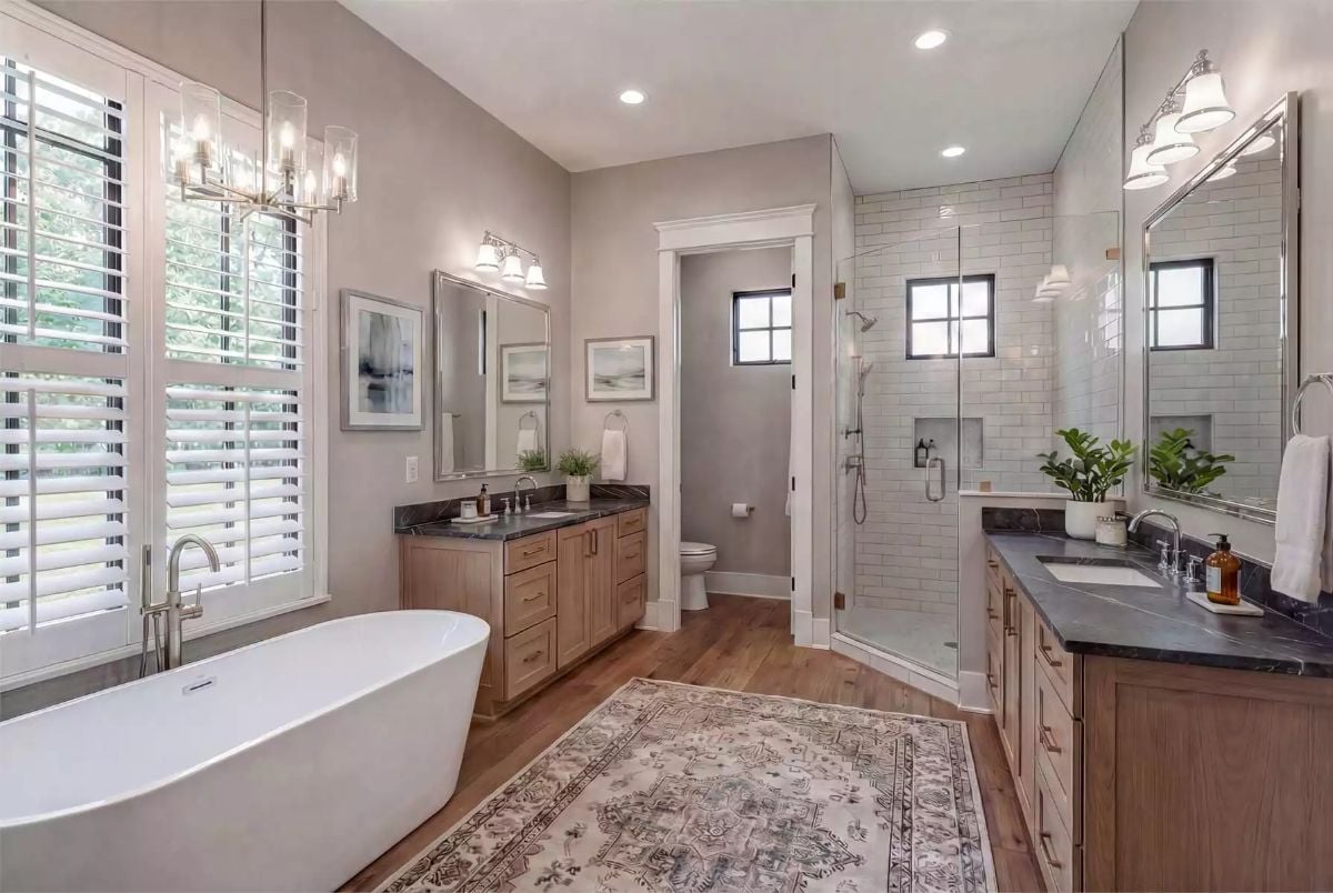 Freestanding Soaker Tub and Dual Vanities Give This Primary Bath a Spa-Like Purpose