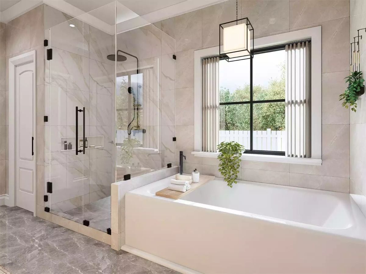 Marble Tile, Glass Enclosure, and Soaking Tub Shape This Transitional Master Bath