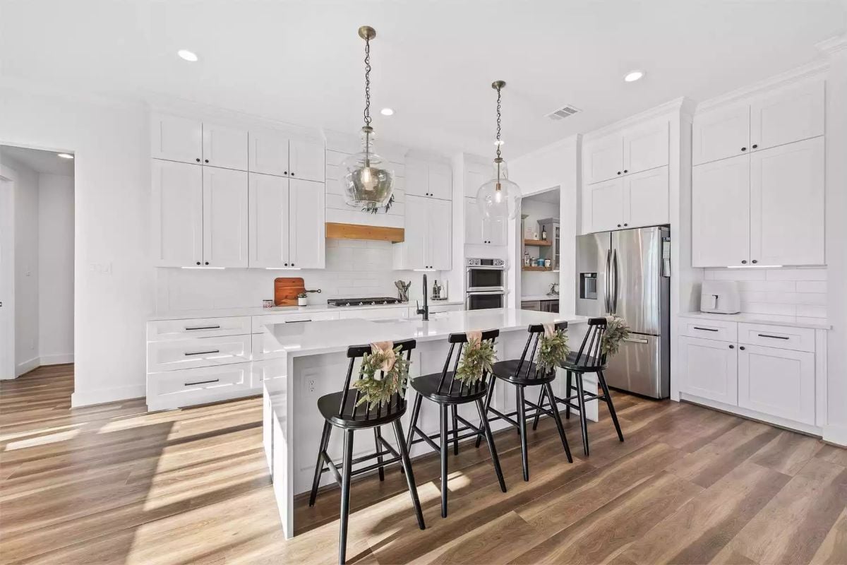 Black Barstools and White Cabinetry Make a Bold Kitchen Contrast