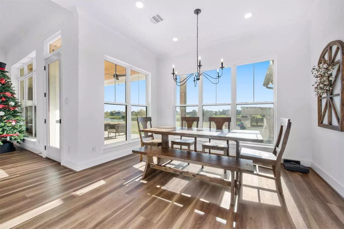 Sunlit Dining Nook Pairs Bench Seating with Views Across Open Fields