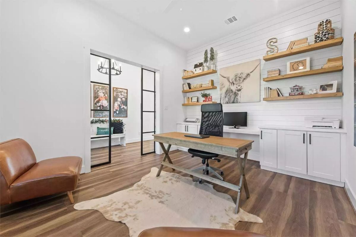 Shiplap Wall and Floating Shelves Define a Farmhouse Home Office