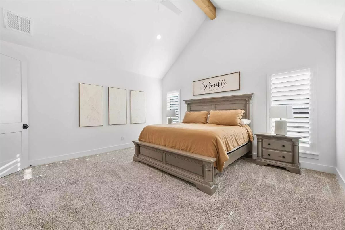 Vaulted Ceilings and Gray Bedroom Furniture Anchor a Farmhouse Master Suite
