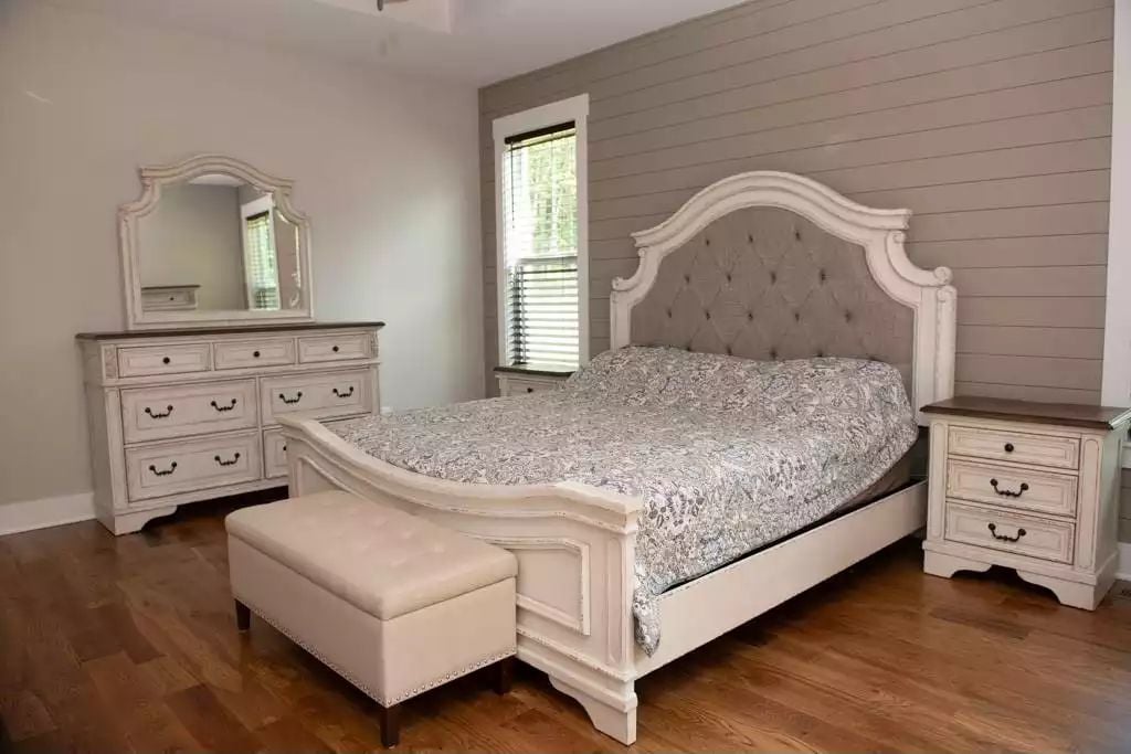 Tufted Headboard and Shiplap Wall Set the Tone in This Farmhouse Master Bedroom