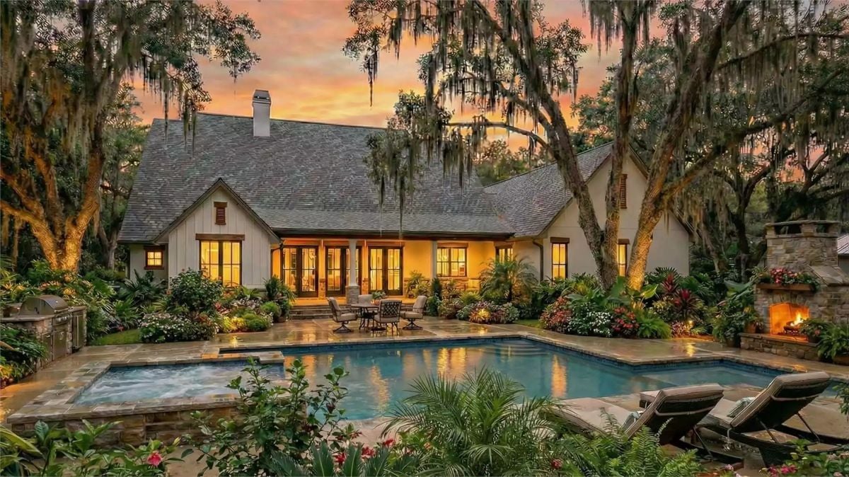 Draped Live Oaks and a Glowing Pool Patio at Dusk