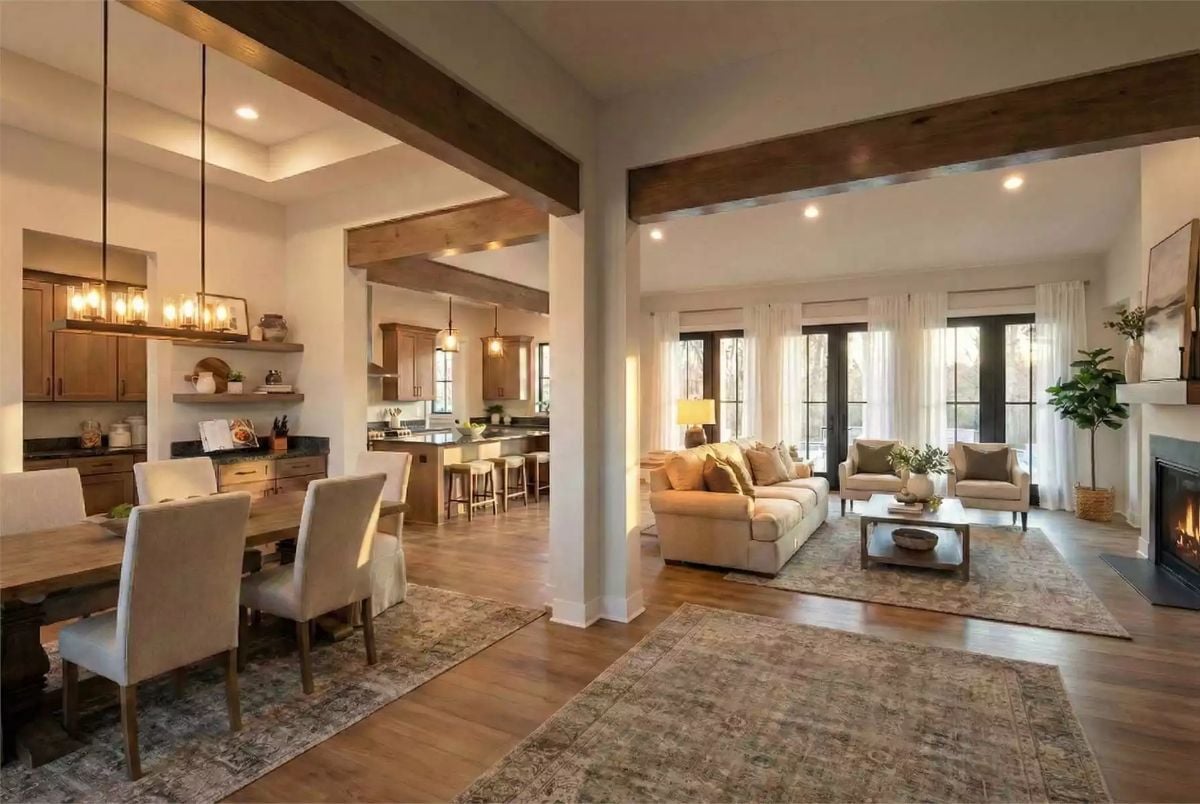 Exposed Beams and Warm Wood Anchor an Open-Concept Living Space