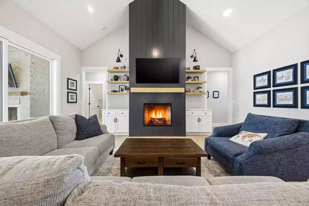 Dark Shiplap Fireplace Tower Anchors a Vaulted Family Room