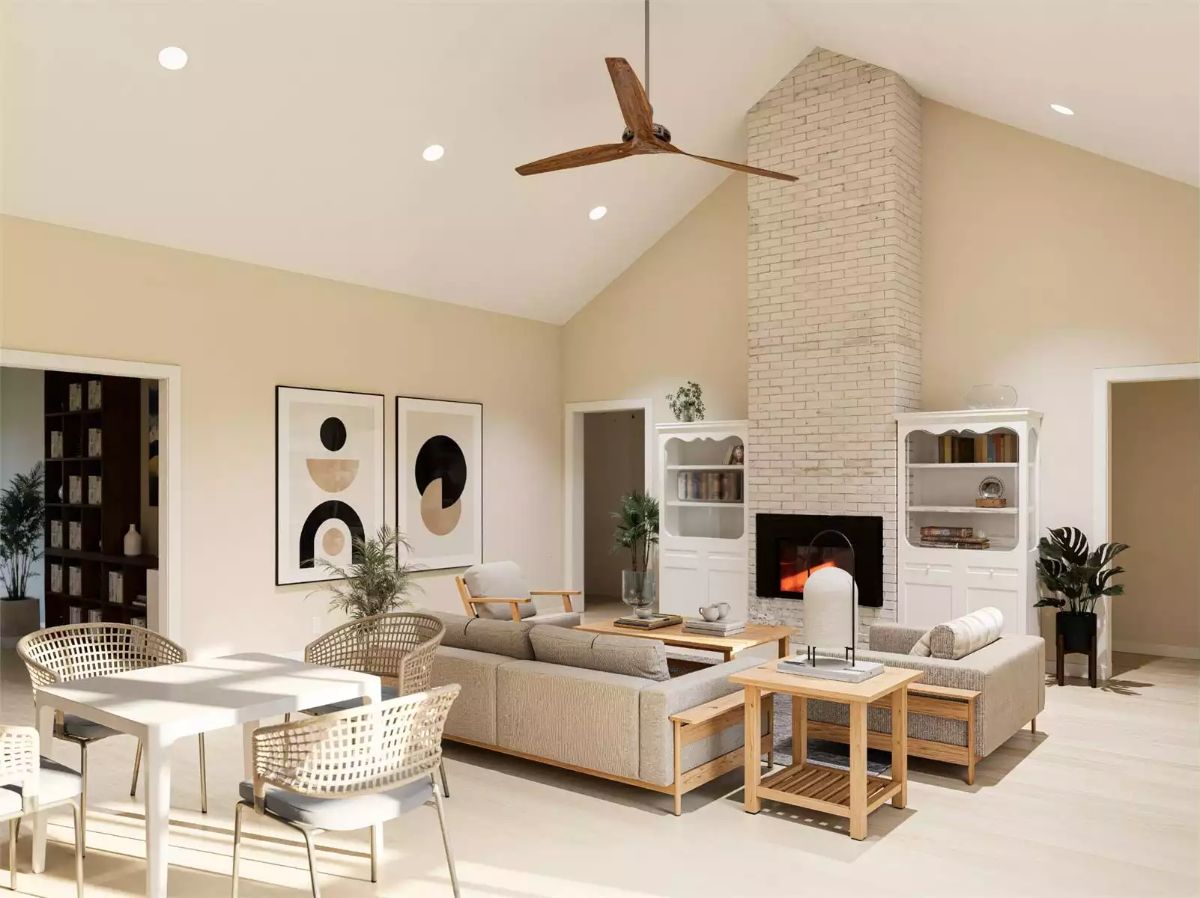 Vaulted Living Room with White Brick Fireplace and Geometric Art