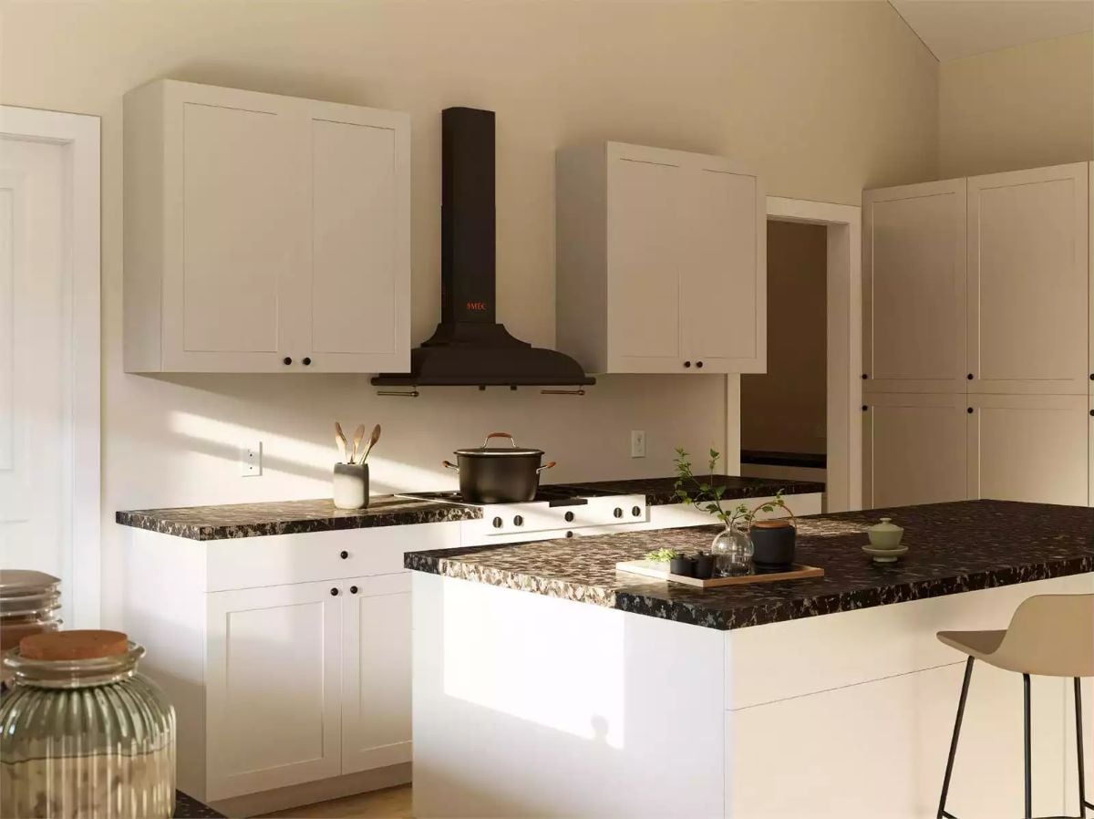 White Shaker Kitchen with Dark Speckled Countertops and Black Range Hood