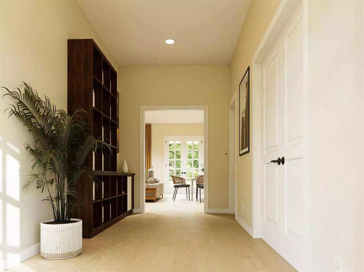 Warm Hallway with Dark Wood Shelving and Palm Accent