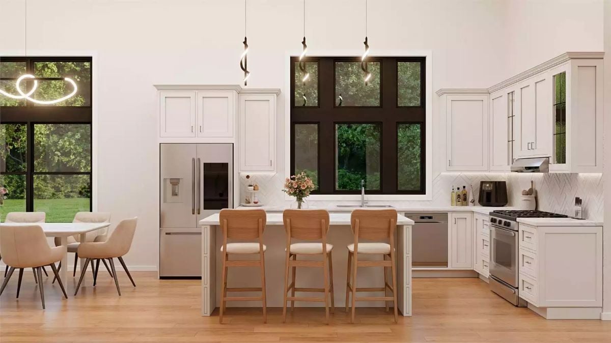 Open Kitchen with Light Wood Island Seating and White Shaker Cabinetry