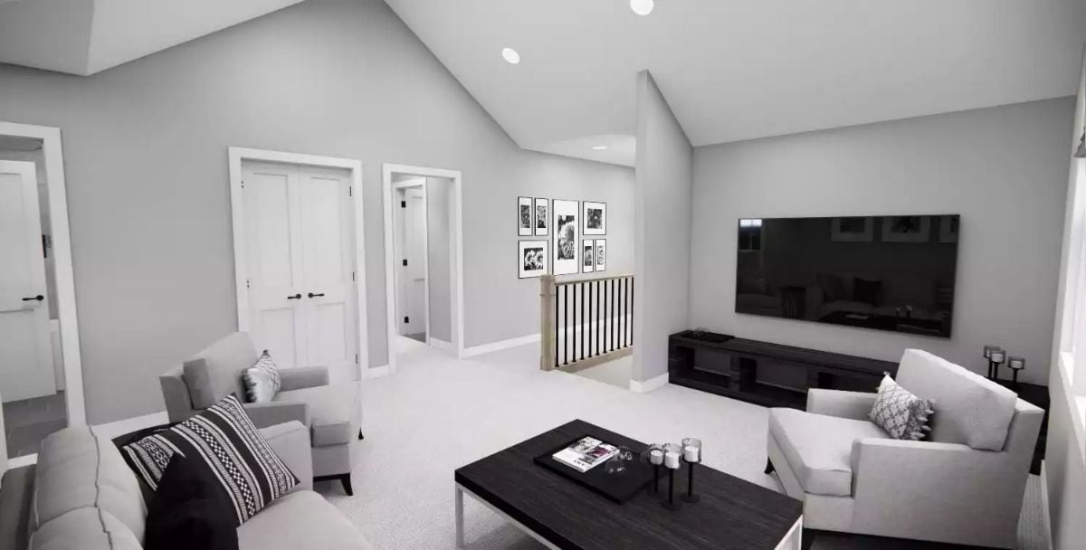 Loft Living Space with Vaulted Ceiling and Black Entertainment Console